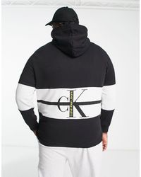 Calvin Klein - Sudadera negra con capucha, diseño color block a rayas y logo - Lyst