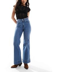 ONLY - Vaqueros De Pernera Ancha Y Talle Alto Con Lavado Claro Y Tachuelas Juicy De -Azul - Lyst