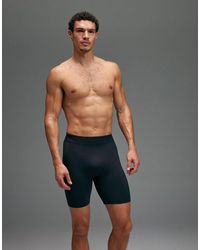 4505 - Seamless Physique Defining Compression Base Layer 8 Inch Half Tight - Lyst
