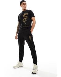 Armani Exchange - – lunar capsule – jogginghose aus em sweatshirt-stoff mit gesticktem drachen-logo - Lyst