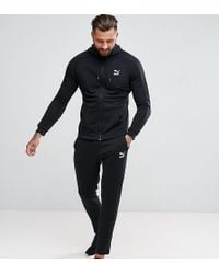 puma black and gold tracksuit