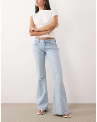 Gina Tricot - Low Waist Flare Ripped Jeans - Lyst