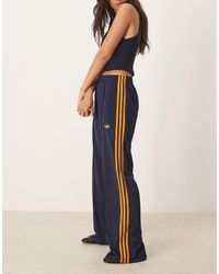 adidas Originals - Pantalones De Chándal Azul Marino Y Naranjas Firebird Loose De - Lyst