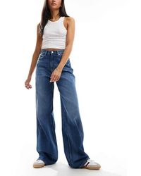 Tommy Hilfiger - Vaqueros De Talle Alto Y Corte Ancho Con Lavado Medio Claire De -Azul - Lyst
