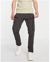 The Couture Club - Pantaloni cargo grigi con zip multiple - Lyst