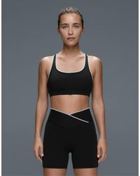Oysho - Medium-support Comfortlux Sports Bra With Contrast Seams - Lyst