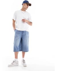 ASOS - Short en jean long avec poches cargo - moyen délavé - Lyst