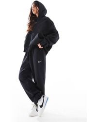 Nike - Phoenix Fleece Oversized High Rise Joggers - Lyst