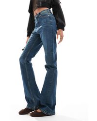 ASOS - Asos Design Tall Mid Rise Flare Jeans - Lyst