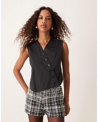 Ghospell - Asymmetrische Elegante Top Met Overslag - Lyst