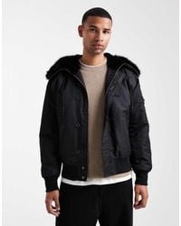ASOS - Chaqueta Bomber Negra Extragrande Con Capucha Con Ribete De Piel Sintética Ma1 De - Lyst
