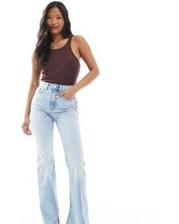 Stradivarius - Petite D74 Flare Slit Jean - Lyst