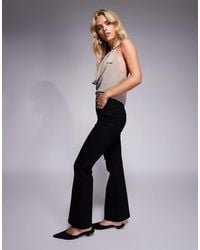 ASOS - Asos Design Petite Power Stretch Sculpt Flare Jeans - Lyst