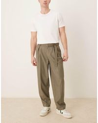 ASOS - Pantalones De Vestir Caquis De Corte Tapered Extragrande Con Cinturón Y Pinzas De -Verde - Lyst