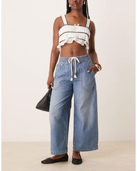 Free People - Jean large à enfiler avec détail noué - moyen délavé - Lyst