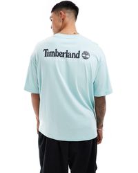 Timberland - T-shirt azzurra oversize con scritta grande del logo sul retro - Lyst
