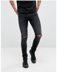 ASOS Enge, 12,5oz schwere Jeans in verwaschenem Schwarz mit zerrissenen Knien