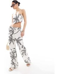 4th & Reckless - Pantalon d'ensemble ample en lin mélangé à imprimé palmiers - beige - Lyst