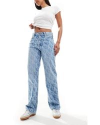 Calvin Klein - – mittele jeans im stil der 90er-jahre mit markentypischem all-over-print - Lyst
