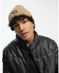Guess - Bonnet en maille à logo - fauve - Lyst