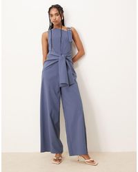 ASOS - Tuta Jumpsuit Asimmetrica Con Dettaglio Avvolgente E Spallina Con Dettaglio Oro Effetto Fuso - Lyst