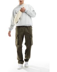 ASOS - Pantalones cargo caquis holgados con cinturilla elástica - Lyst