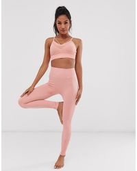 Nike Yoga - Nahtlose Leggings in Rosa - Pink