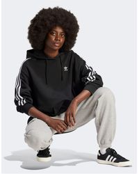 adidas Originals - Adicolor - felpa oversize nera con cappuccio e 3 strisce - Lyst