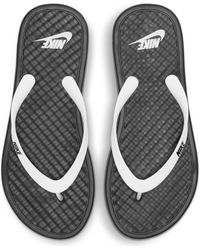black and white nike flip flops