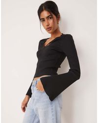 ASOS - Rib V Neck Top With Lace Trim And Flared Sleeve - Lyst