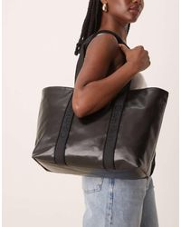 Calvin Klein - Bolso Tote Grande Con Acabado Ultrabrillante De - Lyst