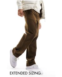 ASOS - Pantalones marrones holgados sin cierres con cintura elástica - Lyst
