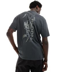 ASOS - Camiseta lavado holgada con estampado floral en la espalda - Lyst