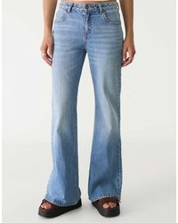 Stradivarius - Comfortabele Flared Jeans - Lyst