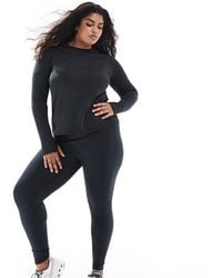 4505 - Curve Icon Active Tie Waist Run Legging With Phone Pocket - Lyst
