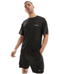 ASOS 4505 - Camiseta negra deportiva suelta con estampado gráfico en el pecho - Lyst