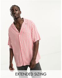 ASOS - Camisa larga color óxido estilo bolera a rayas extragrande con solapas - Lyst