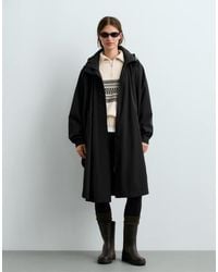 Oysho - Extra Lightweight 10K Waterproof Long Cape - Lyst
