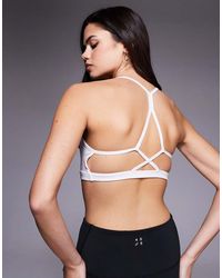 4505 - Open Back Light Support Sports Bra With Removable Padding - Lyst