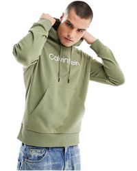 Calvin Klein - Sudadera verde cómoda con capucha y logo hero - Lyst