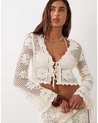 The Frolic - Exclusive Crochet Tie Front Long Sleeve Beach Crop Top - Lyst