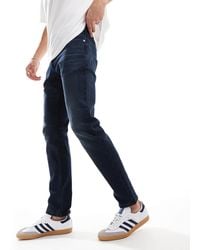 Tommy Hilfiger - – scanton – jeans mit schmalem schnitt aus denim - Lyst