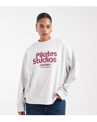 ASOS - Asos Design Curve Oversized Sweatshirt With Pilates Studios Graphic - Lyst