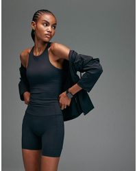 4505 - Premium Internal Support Running Vest With Bonded Seams And Zip Phone Pocket - Lyst
