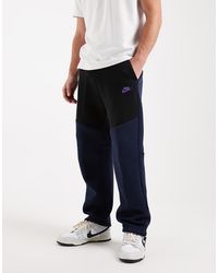 Nike - Joggers Negros Y Azul Marino Con Bajos Abiertos Tech Fleece De - Lyst