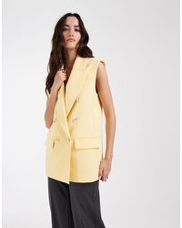 ASOS - Blazer ajusté sans manches à double boutonnage et épaulettes - beurre - Lyst