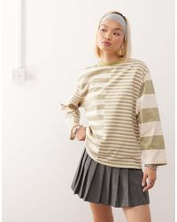 Reclaimed (vintage) - T-shirt à manches longues avec rayures variées effet raccordé - écru/kaki - Lyst