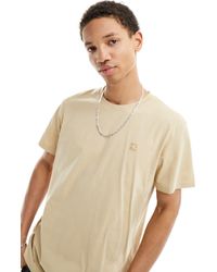 Calvin Klein - Camiseta color arena con parche bordado - Lyst