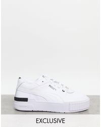 PUMA Leather Cali Sport Wild Cats Trainers in White - Lyst