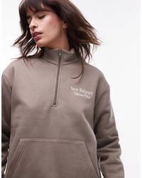 New Balance - Sweat à capuche à col zippé et imprimé graphique - Lyst